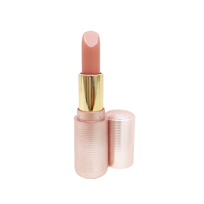 Lex and Jong Lip Rouge demi matte lipstick in shade Bardot - a pinky nude lip color with peach undertones. Fluted ribbed rose gold cosmetic packaging