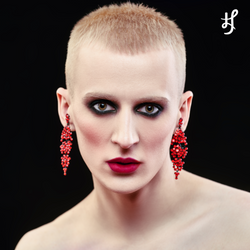 Beauty photography makeup punk androgynous inspiration campaign on male model with earrings. Featuring Lex asnd Jong Lip Rouge demi matte sculpting lipstick in Genius of Love - a wearble neutral fuchsia with muted pink red tone. 